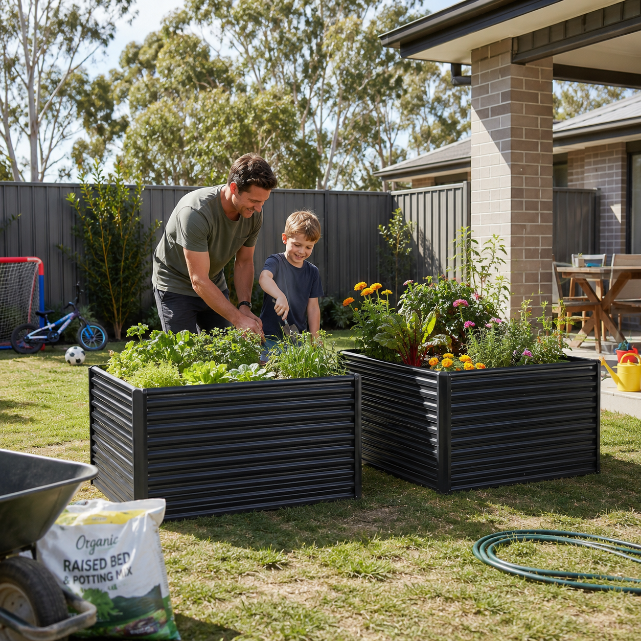 2 in 1 medium steel garden bed with a man and child tending to a garden with raised beds in a backyard setting
