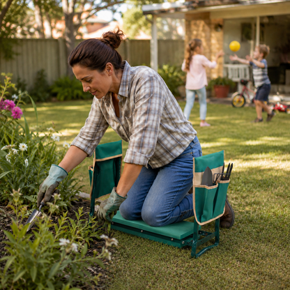 A woman kneels in a grassy backyard garden bed using a green kneeling gardening stool with side pockets, while gardening. Two children play in the background on a sunny lawn.
