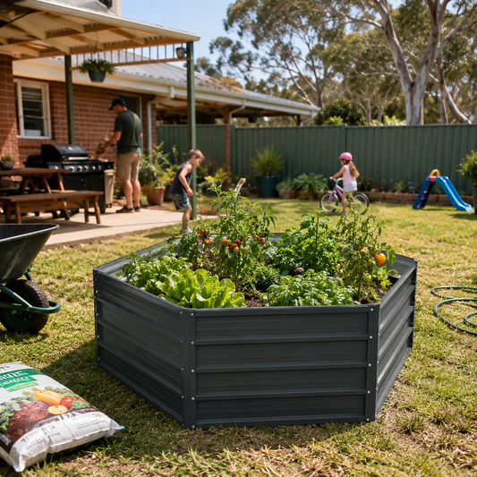 Hexagonal Steel Raised Garden Beds with plants in a backyard setting with children playing and a house in the background.