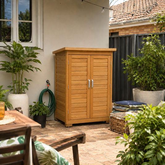 Wooden storage cabinet on a patio with plants and outdoor furniture