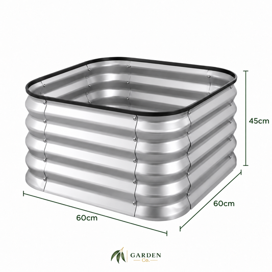 A square corrugated metal garden planter with a black rubber gasket rim, shown with dimension lines indicating 60cm by 60cm by 45cm measurements, on a white background with the Garden Co logo at the bottom.