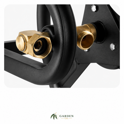 Close-up of a black metal garden hose reel with brass connection fittings, shown against a white background with a Garden Supply logo at the bottom.