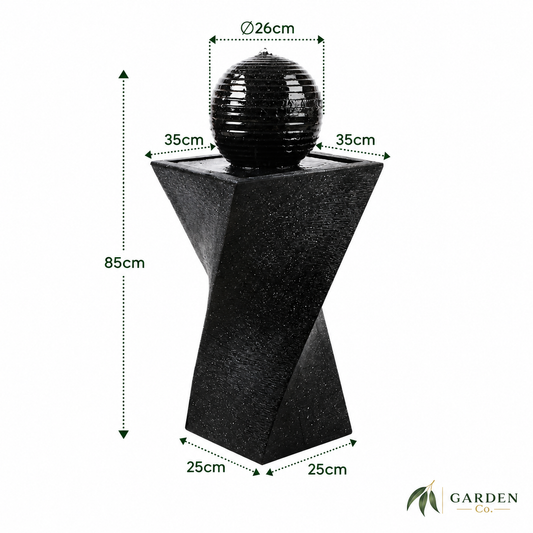 Black twisted geometric pedestal fountain with a spherical water feature on top, shown with dimension labels: 85cm height, 26cm sphere diameter, and 35cm/25cm base measurements on a white background.