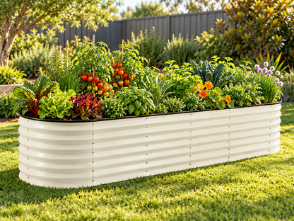 Medium Raised Oval Garden Bed White – On a backyard lawn, planted with tomatoes, leafy greens, herbs and flowers.